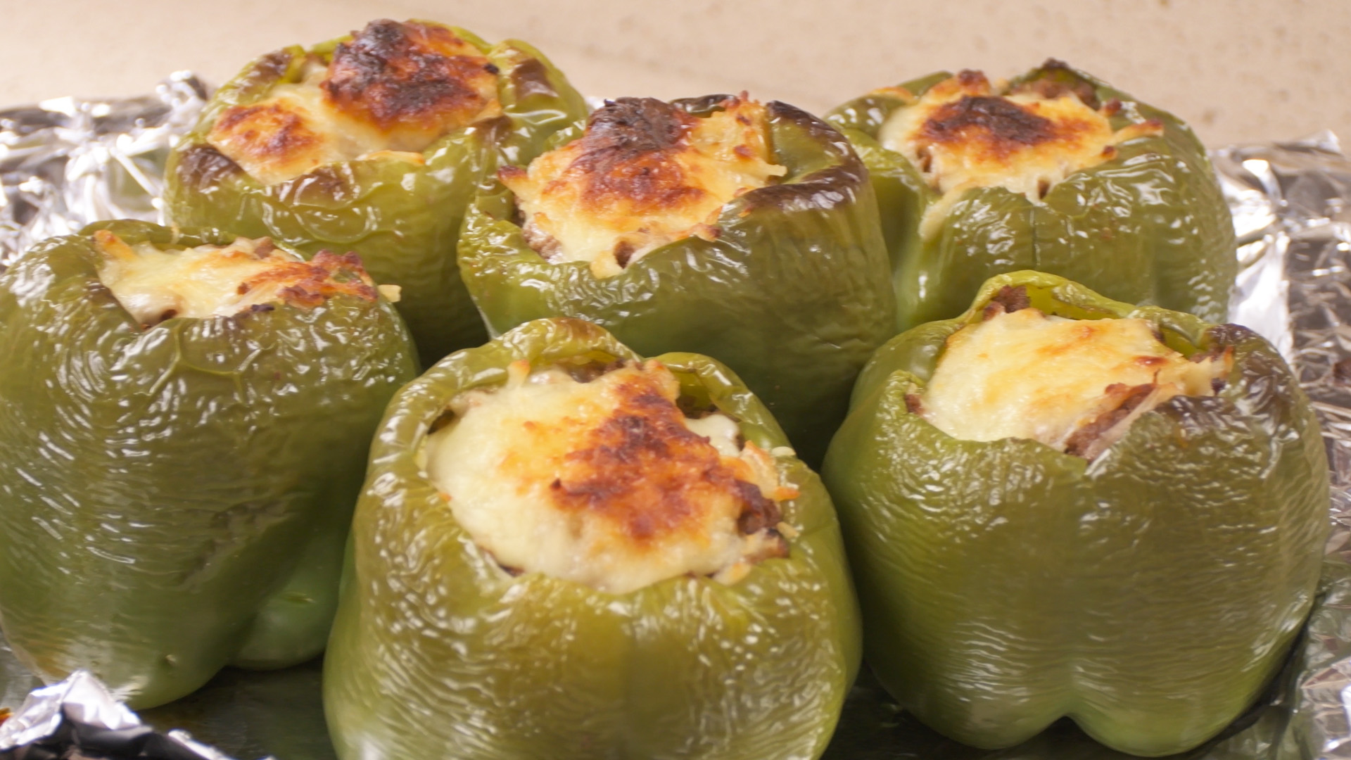 Peppers Stuffed with Ground Meat, Potato, and Cheese